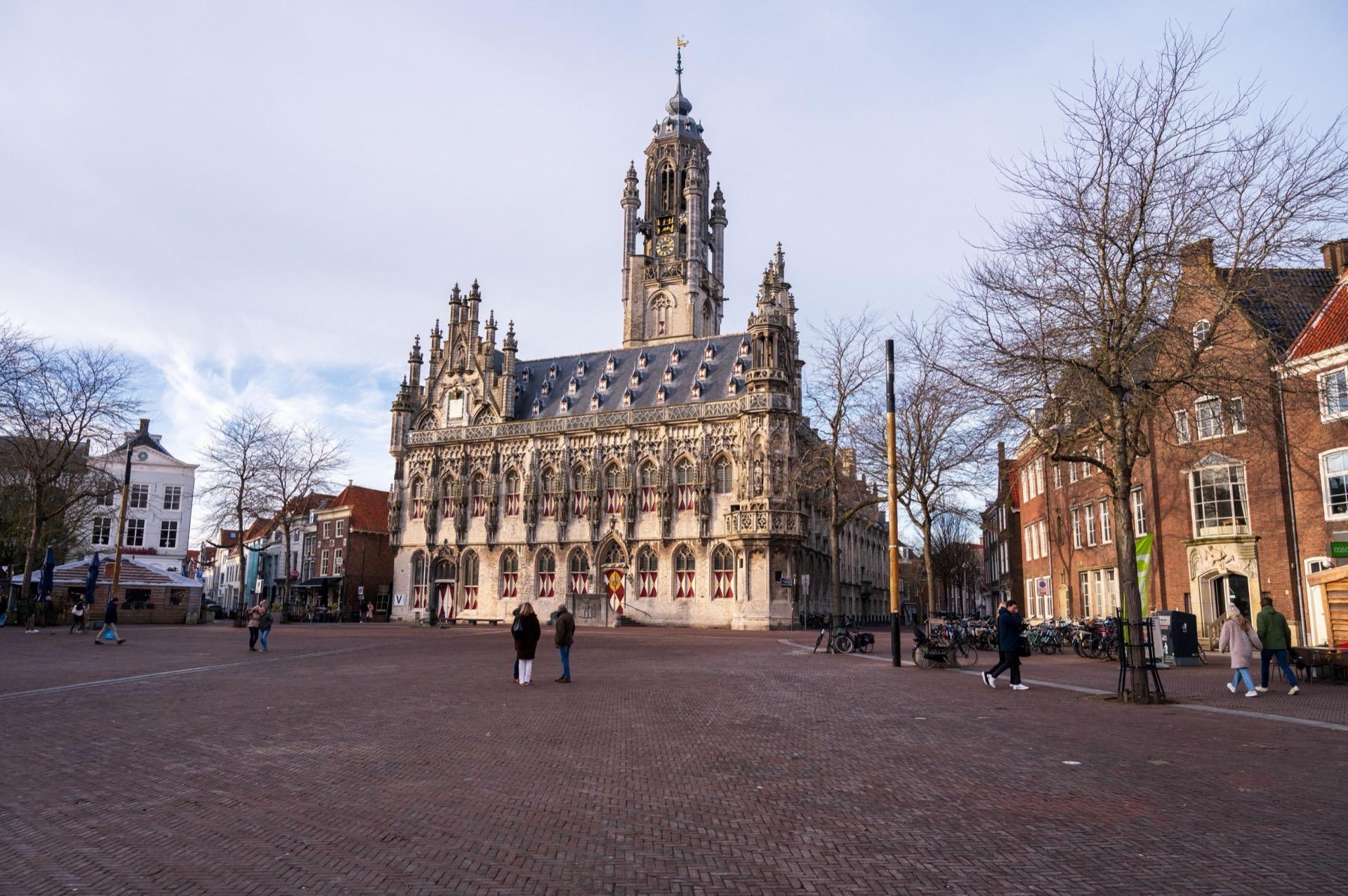 The late Gothic town hall of Middelburg across the empty market square, its tower rising above the roofline