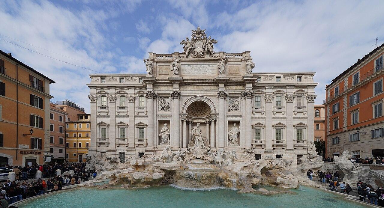The Trevi Fountain seen in full width, with the palace facade behind it