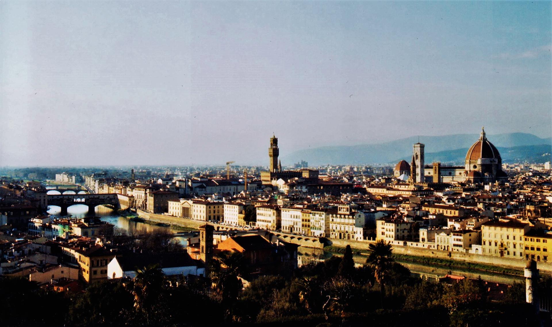 The skyline of Florence with the Arno and its bridges, the tower of Palazzo Vecchio and the dome of the cathedral